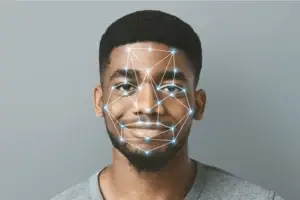 Man's face with digital facial recognition pattern overlay